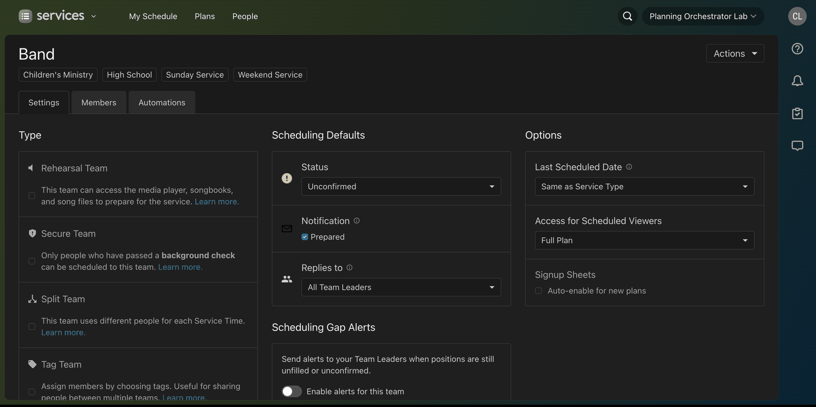 A team's settings page in Planning Center showing the Signup Sheets auto-enable option and the Replies to setting under Scheduling Defaults